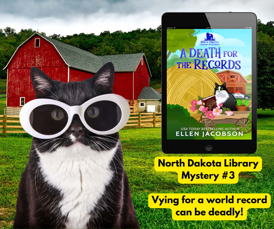 Cat wearing sunglasses with a book cover of 'A Death for the Records' by Ellen Jacobson in front of a red barn.